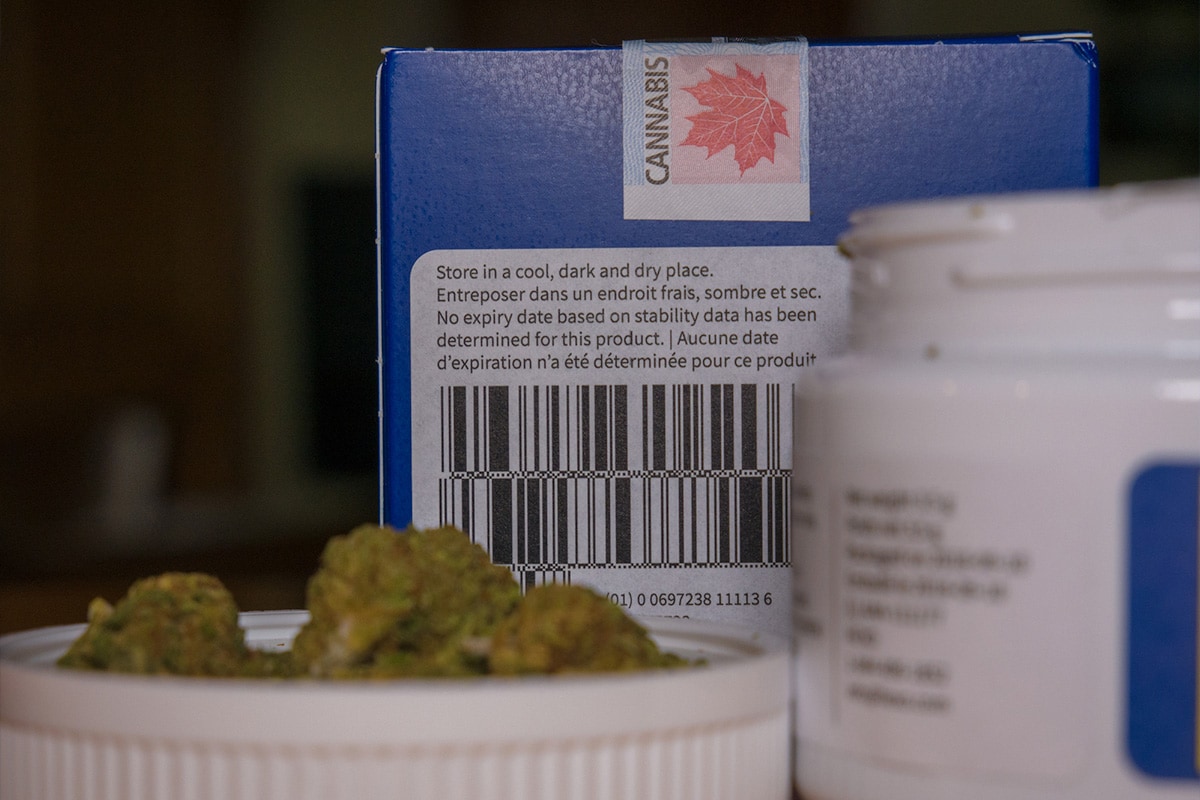 custom-label-design Close-up of cannabis packaging and product